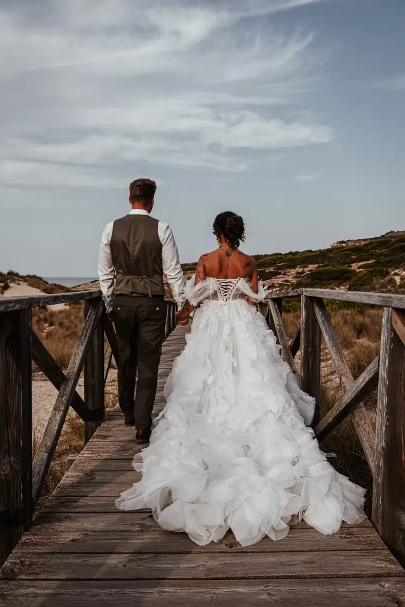Wedding couple kissing with the Mediterranean Sea in the background