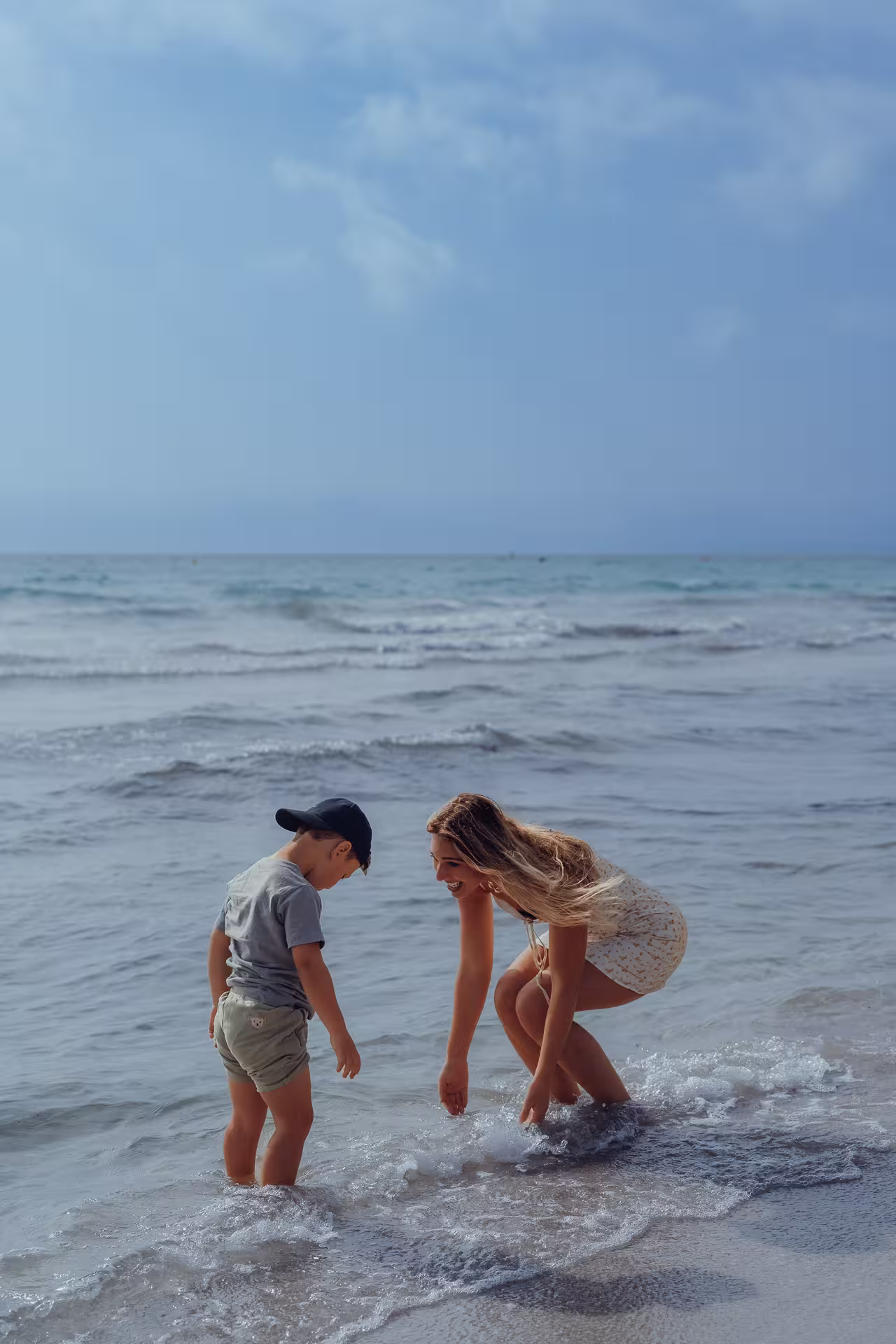 Mother and son playing in the sea at Alcudia