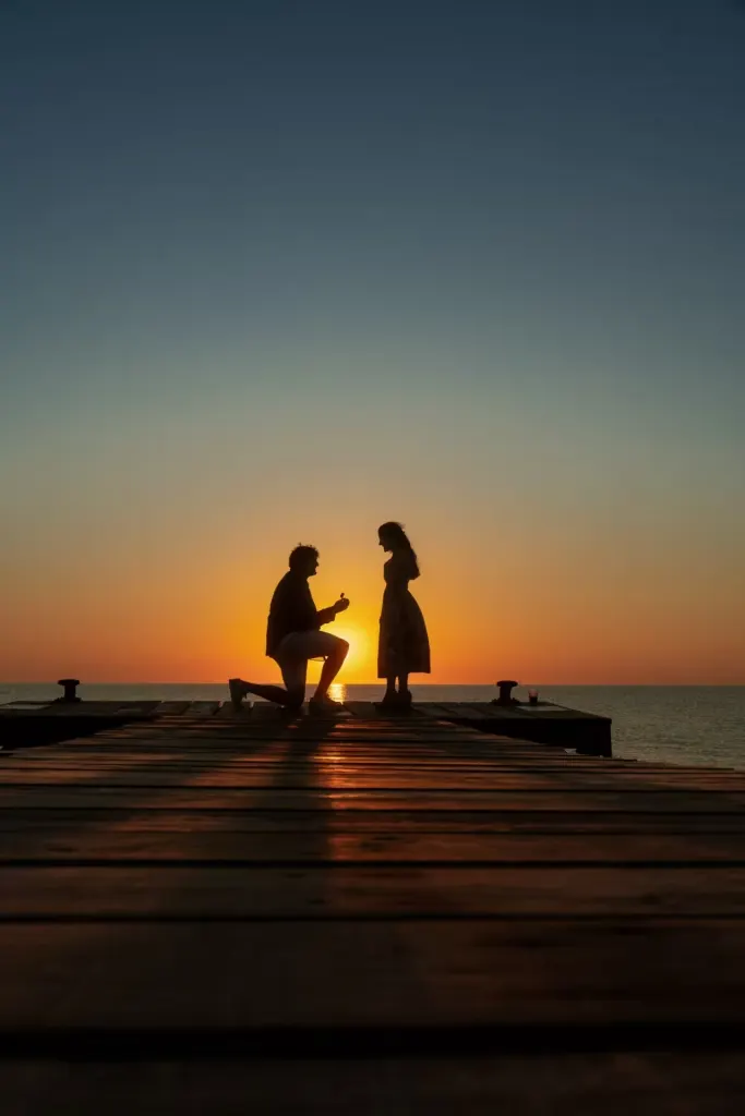 Silhouette of a romantic proposal at sunset in Mallorca