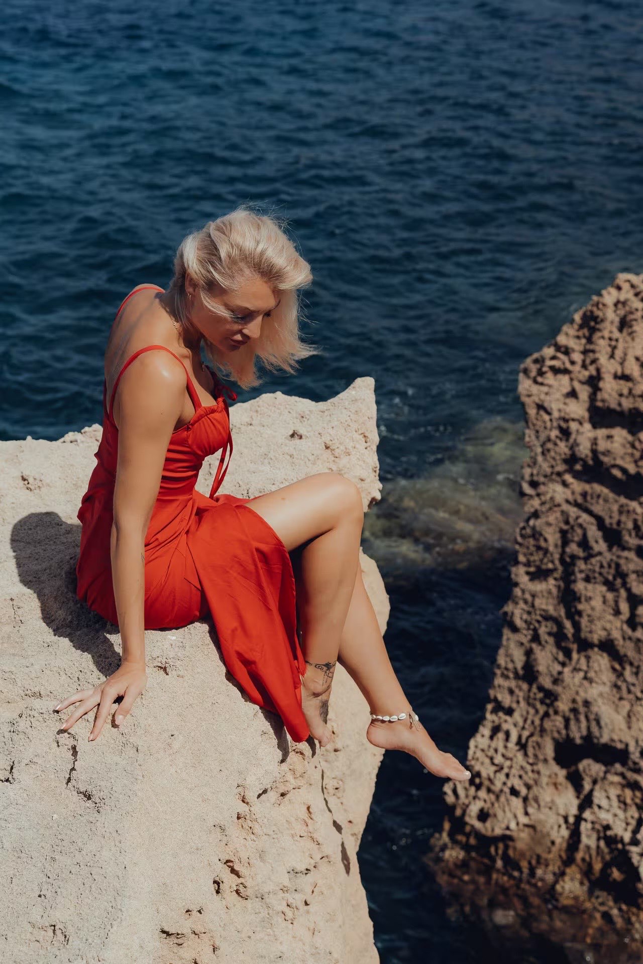 Couple at Cala Comte beach, Ibiza – romantic holiday photo shoot with turquoise water