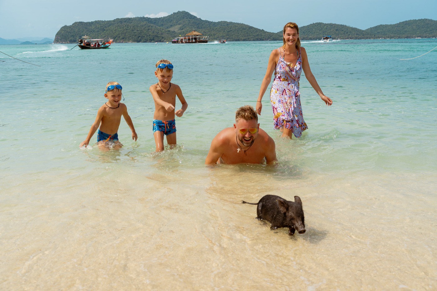 Family photo in Krabi, Thailand – turquoise water and dramatic limestone cliffs as backdrop