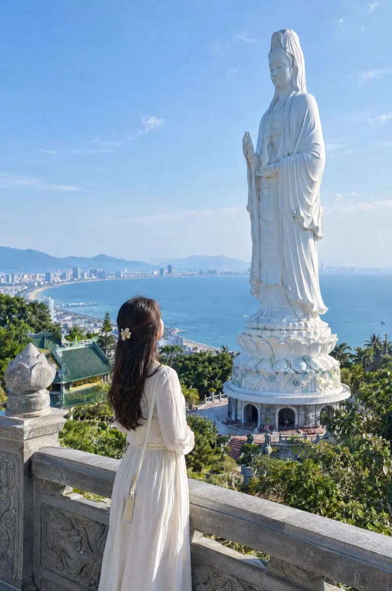 Woman in front of the Lady Buddha statue at Linh Ung Pagoda on the Son Tra peninsula