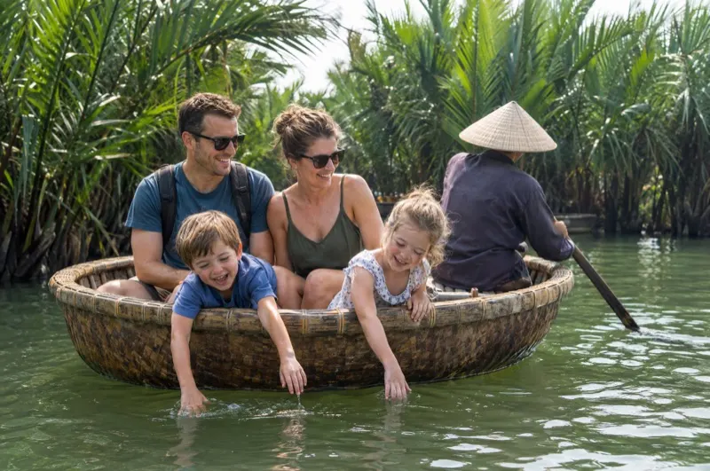 Family photoshoot in Vietnam – family in a round basket boat in the Cam Thanh coconut forest near Hoi An