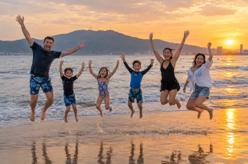 Vietnam photoshoot with friends – two families jumping at sunrise on My Khe Beach in Da Nang
